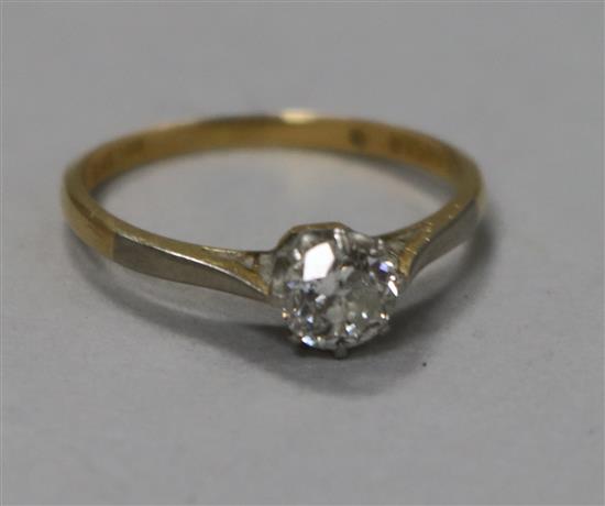 An 18ct gold and platinum solitaire diamond ring,
